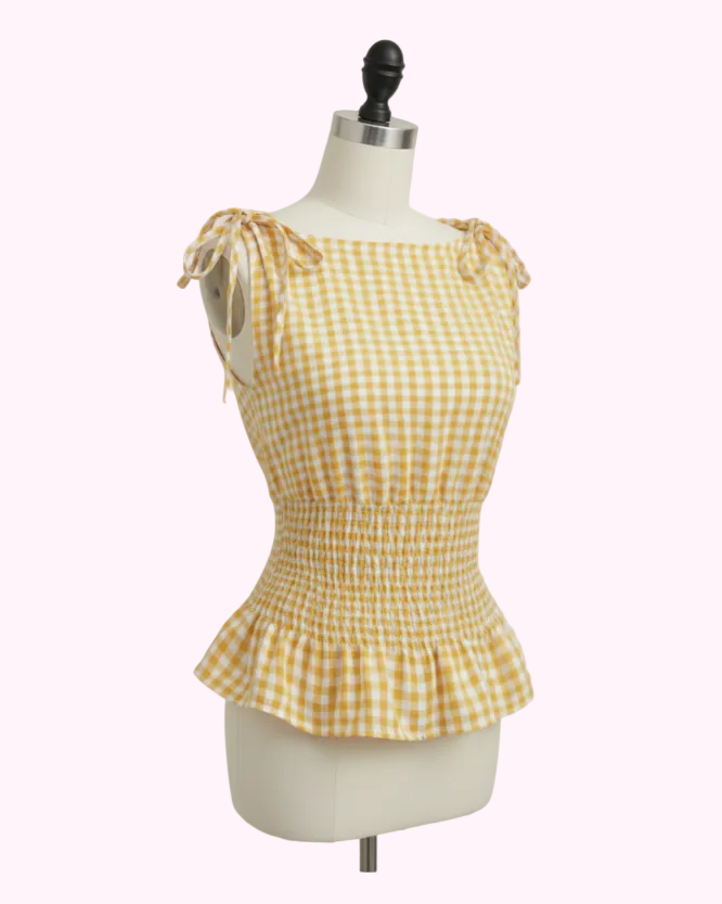 Gul gingham top på hvid mannequin